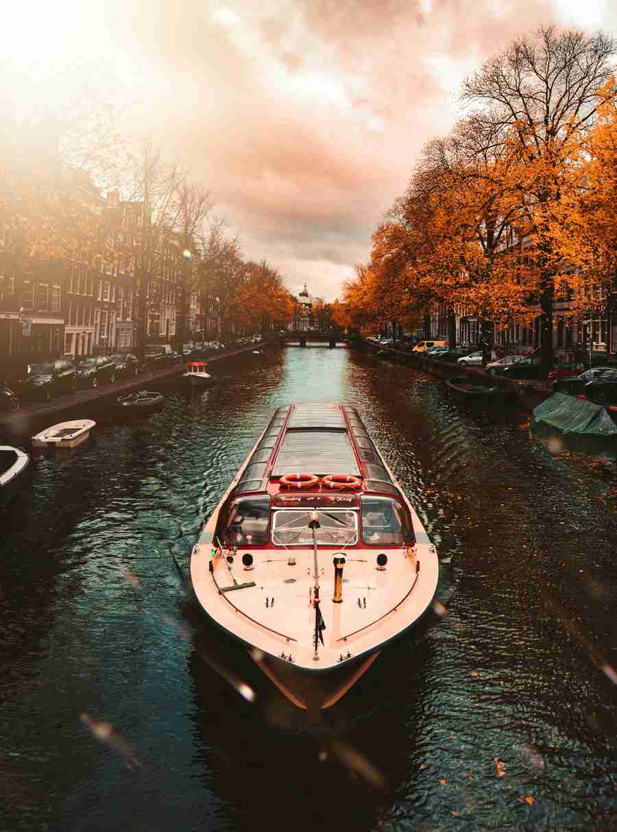 Enjoy a scenic boat tour through Amsterdams charming canals. - amsterdam Tour Packages Pikme.org